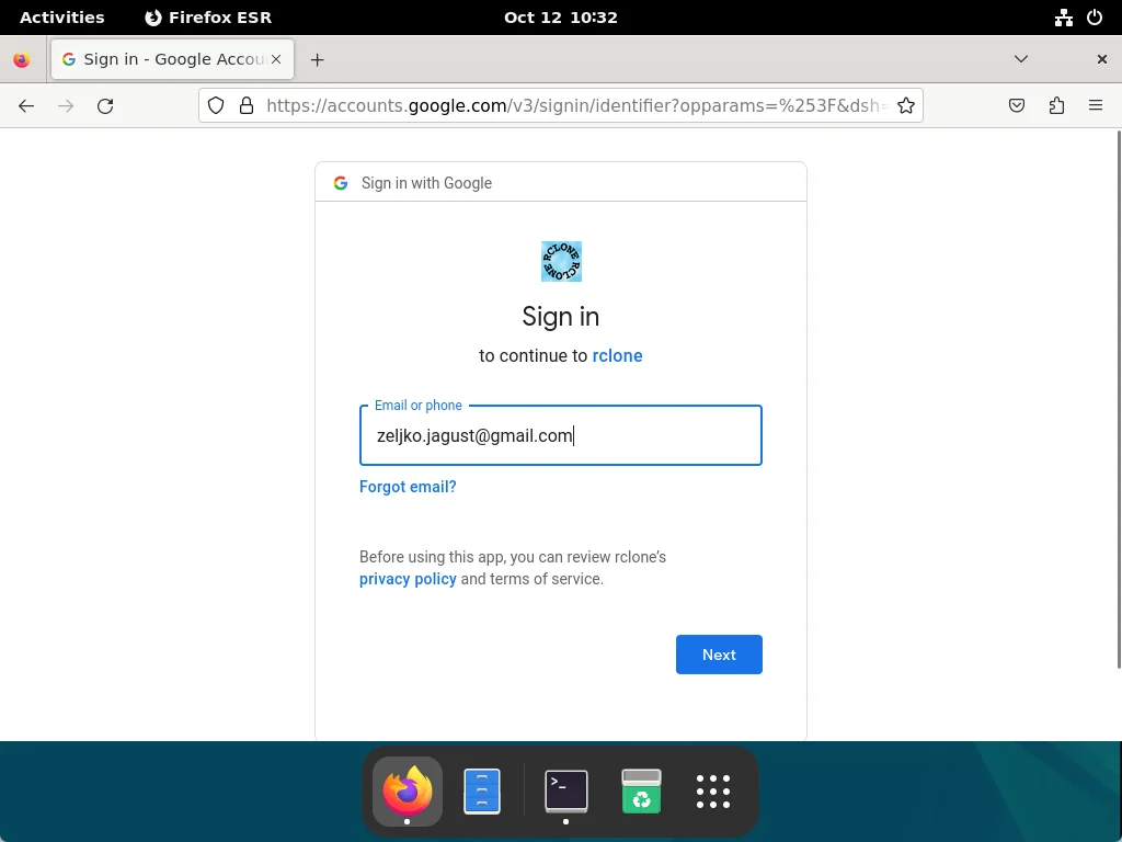 Firefox browser running and showing a Google login screen.