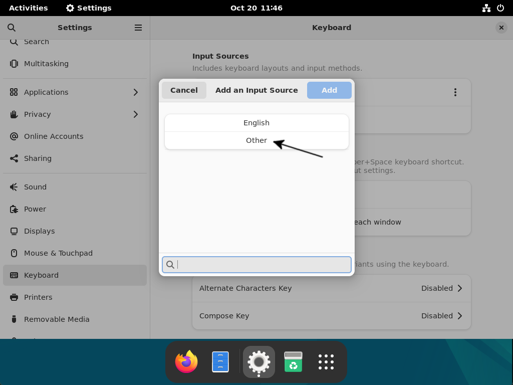 A context window to add an input source on Debian is active.