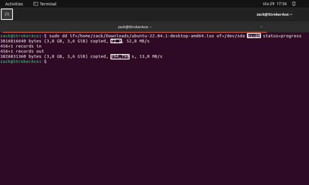 Linux terminal application is running, showing the example of dd command writing the content of ISO file to a USB media.